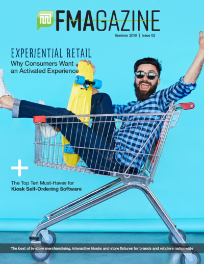 Blue magazine cover with man in shopping cart